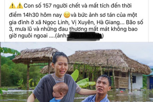 Sự thật về bức ảnh vợ chồng cùng con nhỏ khóc trong 'biển' nước lũ tại Hà Giang